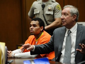 Chris Brown is seen in the courtroom with attorney Mark Geragos during a hearing at Criminal Courts in Los Angeles May 1, 2014. REUTERS/Kevork Djansezian/Pool