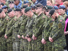 Armed forces personnel from CFB Kingston bow their heads during the National Day of Honour ceremony in Kingston on Friday. IAN MACALPINE /KINGSTON WHIG-STANDARD/QMI AGENCY