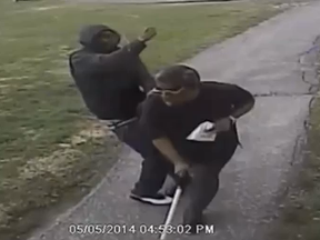 A blind man is robbed of his gold chain in a park in the Warden Ave. and Finch Ave. E. area Monday, May 5, 2014. (Toronto Police video frame grab)