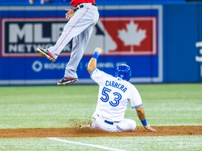 Toronto Blue Jays Melky Cabrera and Los Angeles Angels Howie Kendrick at second base during the third inning at the Rogers Centre on May 9, 2014. (Ernest Doroszuk/Toronto Sun/QMI Agency)
