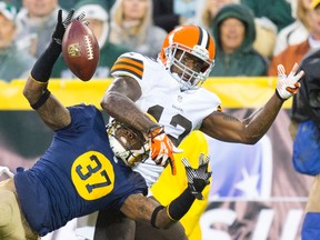 Packers cornerback Sam Shields (37) breaks up the pass intended for Browns receiver Josh Gordon (12) during NFL action in Green Bay, Wisc. in October 2013. Gordon is facing a season-long suspension from the league. (Jeff Hanisch-USA TODAY Sports/Files)