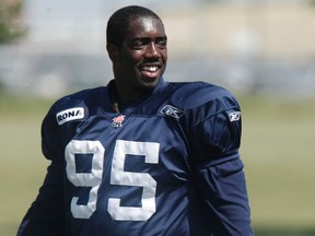 Ottawa RedBlacks lineman Moton Hopkins is all smiles during practice with his former team the Winnipeg Blue Bombers at the St. James Rods Field in July 2010. (MARCEL CRETAIN/QMI Agency)