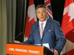 Ontario Finance Minister and Mississauga South Liberal candidate Charles Sousa unveils new ad that targets NDP Leader Andrea Horwath on May 10 2014. Due to an advertising blackout, the ad will appear only on the web until May 21 when it can legally be aired on television. Sousa says he's perplexed why Horwath would force an election over his budget. (Toronto Sun/Antonella Artuso)