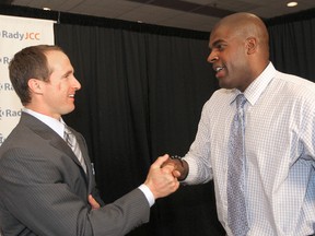 New Orleans Saints quarterback Drew Brees (left) greets former Bomber Kelly Butler at the Rady dinner in Winnipeg, Man. Thursday June 13, 2013. The pair were teammates for a year at Purdue University when Butler was a freshman and Brees was a senior. (BRIAN DONOGH/WINNIPEG SUN/QMI AGENCY)