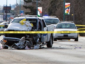 A Royal Canadian Mounted Police truck sits smashed up at a crime scene, in St. Paul, Alberta, May 10, 2014. An unidentified gunman was killed and three Royal Canadian Mounted Police (RCMP) officers were injured in the incident, according to local media. REUTERS/Amber Bracken (CANADA - Tags: CRIME LAW)