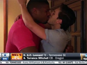 Michael Sam (left) kisses his boyfriend after being drafted 249th overall by the St. Louis Rams on Saturday. (YouTube)