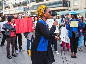 Chizoba Imoka calls for the safe return of Nigerian schoolgirls abducted by Islamist extremist group - Boko Haram - during a demonstration at Yonge-Dundas Square in Torontoon May 10, 2014. (Ernest Doroszuk/Toronto Sun)