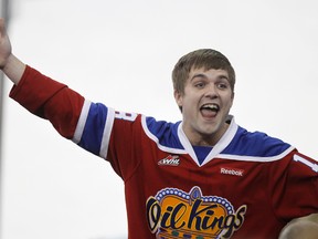 An Edmonton Oil Kings fan pumps up the crowd during the game against the Calgary Hitmen held at Rexall Place in Edmonton, Alta., on Friday, April 26, 2013. The Oil Kings won the game 5-1. Ian Kucerak/Edmonton Sun/QMI Agency