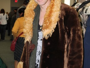Grant Jeffery hesitated to purchase this fur coat at the OC Transpo lost and found sale on Saturday. But decided against it. (Jessie Archambault/Ottawa Sun)