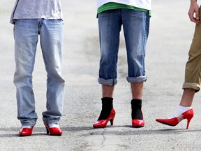 Men in high heels await the beginning of this year's Walk a Mile in Her Shoes in downtown Belleville Saturday, May 10, 2014.  - Emily Mountney/The Intelligencer/QMI Agency