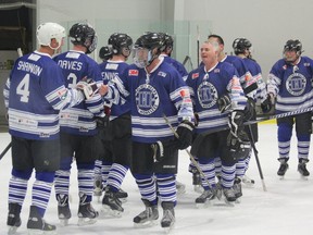 Players shake hands after a game at the Hockey Helps the Homeless tournament in London on Saturday. The one-day tournament, held at the Western Fair District Sports Centre, gave recreation league skaters the opportunity to play alongside NHL greats and women?s Olympic gold-medal team members.All money raised from the tournament goes to support London organizations working with homeless people. DALE CARRUTHERS / THE LONDON FREE PRESS / QMI AGENCY