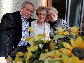 Inga McLeod is flanked by John and Bonnie Walters at Inga's Edmonton home.