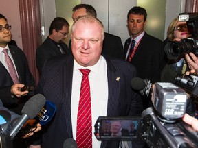 Toronto Mayor Rob Ford speaks with members of the media after attending the Big City Mayors' Caucus meeting in Ottawa, Feb. 26, 2014. (Errol McGihon/QMI Agency)