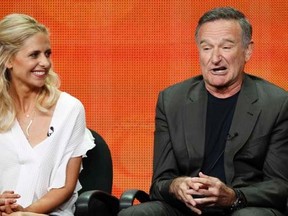 Cast member Robin Williams speaks next to co-star Sarah Michelle Gellar at a panel for the television series "The Crazy Ones" during the CBS portion of the Television Critics Association Summer press tour in Beverly Hills, California July 29, 2013.  REUTERS/Mario Anzuoni