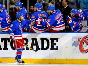 New York Rangers right wing Martin St. Louis (26) is congratulated after scoring a first period goal against the Pittsburgh Penguins in game six of the second round of the 2014 Stanley Cup Playoffs at Madison Square Garden on May 11, 2014 in New York, NY, USA. (Andy Marlin/USA TODAY Sports)