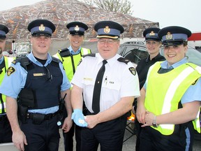 OPP officers on scene interpreted a comparatively quiet Prescription Drug Drop-Off Day at the Canadian Tire parking lot as an indication encouragement to dispose of outdated, unwanted or unused medications in a timely manner is paying off. From left in the photo, are: Auxiliary Constable Shane Cumberland, Auxiliary Constable Victoria Camboia, Constable Mike Wilson, Inspector Tim Clark, Constable Lisa Narancsik and Auxiliary Constable Alex Brown. Jeff Tribe/Tillsonburg News