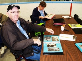 John Wellington leafs through the pages of photos from the 50's and 60's at the Lambton County Seniors Fair on May 6. The photos come from Lambton County Archives. Visitors were invited to try and identify people in the photos.