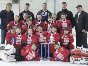 The Chatham Novice spring hockey team won a recent tournament in Port Huron, Michigan. Front row, from left: Jacob Vancoillie, James Larsh. Second row: Declan Waddick, Andrew Goulet, Harrison Oickle, Braden Twigg, Rorey Elson. Third row: Logan Houle, Sam Warriner, Maclean Norris. Fourth row: Cam Wellington, Aidan Wheeler Colton Graham, Brayden Degelas, Brenden McKay. Fifth row: coaches Todd Warriner, Mike Elson, DJ Degelas, Mike Vancoillie, trainer Harvey McKay.