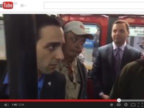 PC Leader Tim Hudak and staff are confronted by transit officers on a TTC subway Sunday, May 11, 2014, in a video posted to YouTube. (Framegrab)