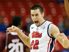 Marshall Henderson of the Mississippi Rebels reacts after hitting a three-point basket against the Mississippi State Bulldogs during the second round of the SEC Men's Basketball Tournament at Georgia Dome on March 13, 2014.  (Kevin C. Cox/Getty Images/AFP)