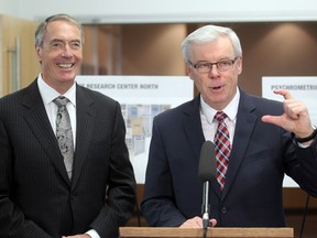 Gerry Price, CEO of the Price Group of Companies (left), looks on as Premier Greg Selinger announces an expansion to the Price operation in Winnipeg, Man. Monday May 12, 2014. (Brian Donogh/Winnipeg Sun/QMI Agency)