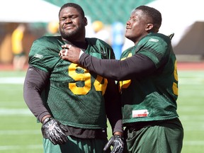 Ted Laurent, left, shown here at practice with Esks teammate DT Almondo Sewell in 2013, was one of the Eskimos most successful picks in the past eight years, although he was taken in the supplemental draft. (David Bloom, Edmonton Sun)