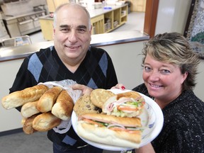 Subway franchisee Craig Kitching (left) and Judy Richichi, director of development at Siloam Mission, display Subway products at the mission in Winnipeg, Man. Monday May 12, 2014. In the past year, Subway Restaurants in Winnipeg have donated more that 35,000 sandwiches and 52,000 cookies to the mission. (Brian Donogh/Winnipeg Sun/QMI Agency)