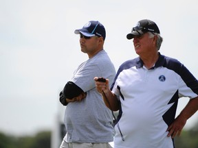 Argonauts head coach Scott Milanovich (left) and GM Jim Barker could be looking to trade down Tuesday at the CFL draft.