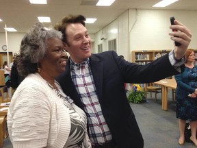 Democratic nominee Clay Aiken takes a pictures with a constituent after a campaign forum in Cary, North Carolina, April 28, 2014. (REUTERS/Colleen Jenkins)