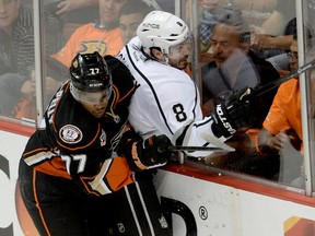 Anaheim Ducks winger Devante Smith-Pelly (left) takes Los Angeles Kings defenceman Drew Doughty  into the boards during their playoff series. (Jayne Kamin/Oncea-USA TODAY Sports)