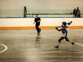 A Vermilion lacrosse player takes a shot on goal while on a breakaway.