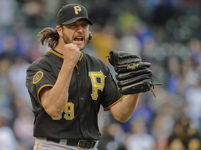 Pittsburgh Pirates relief pitcher Jason Grilli (39) celebrates after defeating the Chicago Cubs 5-4 at Wrigley Field on Apr 10, 2014 in Chicago, IL, USA. (Matt Marton/USA TODAY Sports)