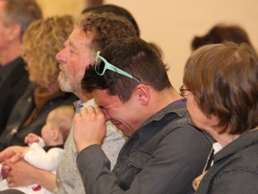 JOHN LAPPA/THE SUDBURY STAR/QMI AGENCY 
Russ Hanson, middle, son of the late Jean Hanson, is overcome with emotion at a dedication ceremony for his mom on Monday, May 12, 2014. Gatchell School was changed to Jean Hanson Public School at the ceremony. See video at www.thesudburystar.com