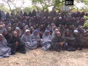 Kidnapped schoolgirls are seen at an unknown location in this still image taken from an undated video released by Nigerian Islamist rebel group Boko Haram. (REUTERS/Boko Haram handout via Reuters TV)