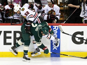 Minnesota Wild defenceman Keith Ballard hits Chicago Blackhawks forward Brandon Bollig during Game 3 of their Western Conference semifinal series at the Xcel Energy Center in St. Paul, Minn., May 6, 2014. (BRACE HEMMELGARN.USA Today)