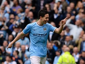 Manchester City's Samir Nasri celebrates after scoring against West Ham United during their English Premier League soccer match at the Etihad Stadium in Manchester, northern England May 11, 2014. (REUTERS)