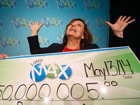 Sophie Rizavas celebrates her $50-million Lotto Max jackpot at the OLG office in Toronto Tuesday, May 13, 2014. (Stan Behal/Toronto Sun)