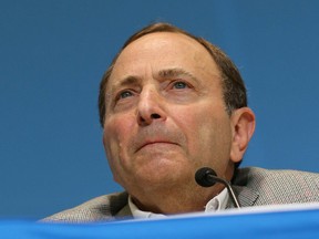 Gary Bettman, commissioner of the National Hockey League, reacts during a press conference at the 2014 Sochi Olympics in Russia, on February 18, 2014. (Al Charest/Calgary Sun/QMI Agency)