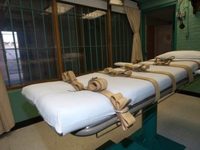The death chamber and the steel bars of the viewing room are seen at the federal penitentiary in Huntsville, Texas September 29, 2010. (REUTERS/Jenevieve Robbins/Texas Dept of Criminal Justice/Handout via Reuters)