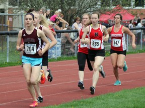 North Lambton's Megan Black (left) went wire to wire in winning the senior girls' 3000m run at the LSSAA Track and Field Championships on Tuesday, May 13. She won the race by over 45 seconds with a time of 11:04.69. (SHAUN BISSON, The Observer)