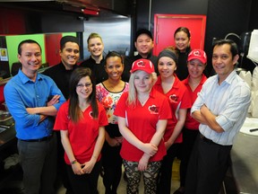 Hearty Fusion Express owners George Titong (far left) and Ronald Zabala (far right) and their employees. Black shirts, from left: Erwin Lirazan, Karen Yanez, Emman Pascual, Annalyn Silverio. Red shirts, from left: Oliviah Sherwood, Clarissa Titong, Allissa Lewis, Autumn Bandravala and Che Dimatulac. Bryan Passifiume photo | QMI Agency