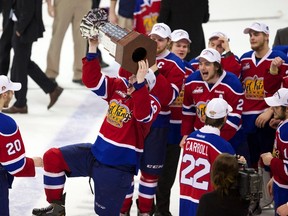 Oil Kings forward Reid Petryk hoists the Ed Chynoweth Cup Monday as he and his teammates celebrate their victory in what was the final WHL game of his hockey-playing career. (Randy L. Rasmussen, The Oregonian)