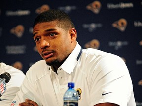 The St. Louis Rams' seventh round pick, defensive end Michael Sam, talks with the media during a press conference at Rams Park. (Jeff Curry/USA TODAY Sports)