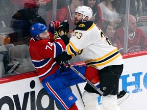 Zdeno Chara takes the Canadiens’ Alexei Emelin into the boards on Monday night. Like many of the Bruins defencemen, Chara could have been better in Game 6. (Eric Bolte/USA Today Sports)