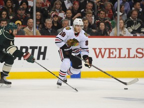 Wild defenceman Clayton Stoner (left) attempts to block a pass by Blackhawks forward Patrick Kane (right) during first period action of Game 6 in their second round playoff series in St. Paul, Minn., on Tuesday, May 13, 2014. (Marilyn Indahl/USA TODAY Sports)