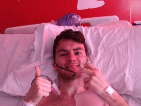 This photo shows Stephen Sutton, 19, of England, in what he thought would be his "final thumbs up." The British teen has raised more than $5 million for a cancer charity by completing a bucket list of experiences. (Photo: Facebook/QMI Agency)