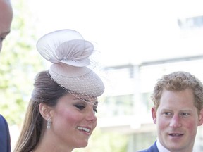 Prince William (L), Kate Middleton, and Prince Harry.

WENN
