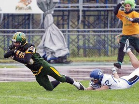 Universite de Montreal kicker Zachary Medeiros,  #17, attempts to tackle a Universite de Sherbrooke player in a 2011 game.
