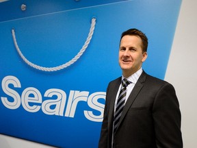 Sears President and CEO Doug Campbell poses after its annual and special meeting of shareholders in Toronto April 24, 2014. (REUTERS/Aaron Harris)