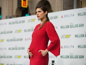 Cast member Lake Bell poses at the premiere of "Million Dollar Arm" at El Capitan theatre in Hollywood, California May 6, 2014. The movie opens in the U.S. on May 16.  REUTERS/Mario Anzuoni